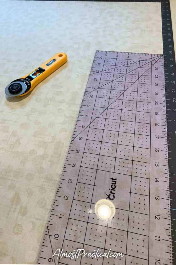 fabric on a cutting mat with a ruler and rotary cutter