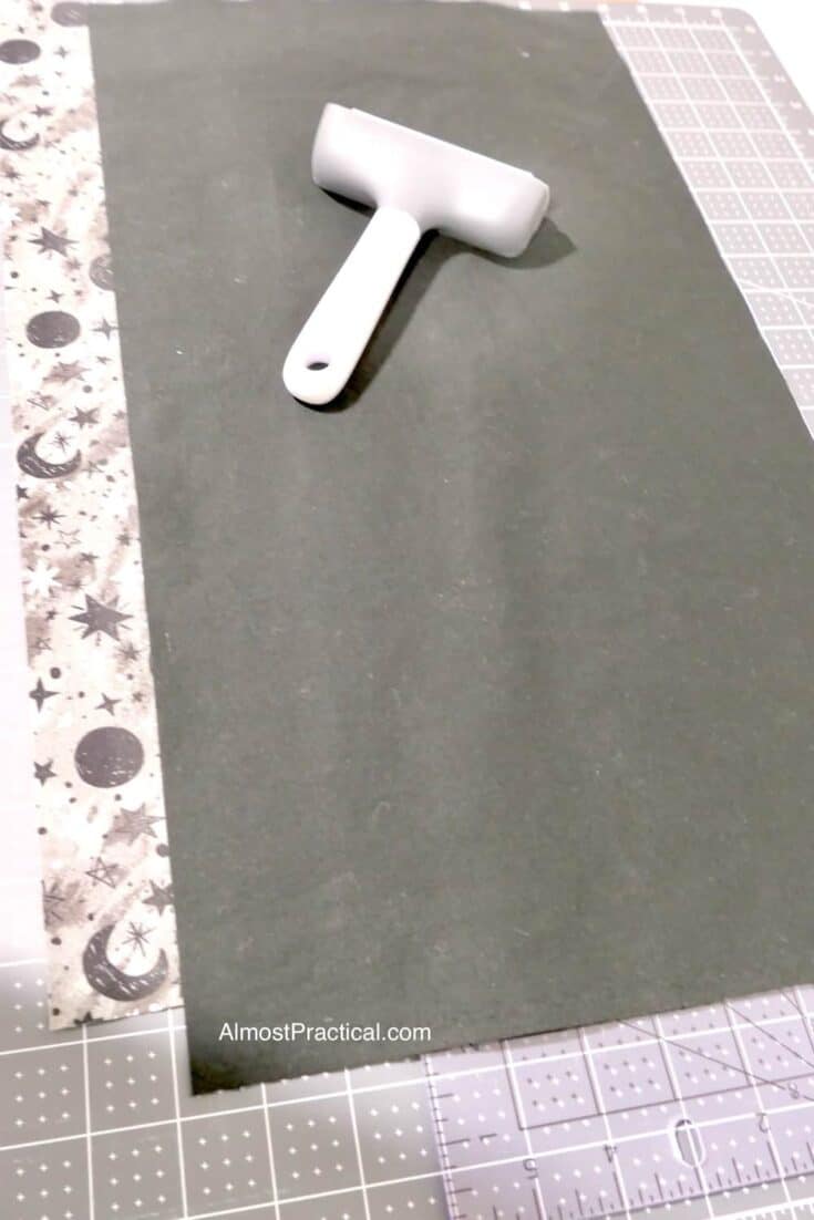 fabric and brayer on cutting mat