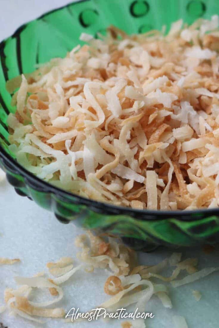 toasted coconut in a vintage green glass bowl