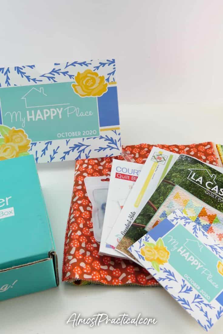 Collection of quilting tools, fabrics, and patterns that were included in the Sew Sampler Subscription Box for October 2020.