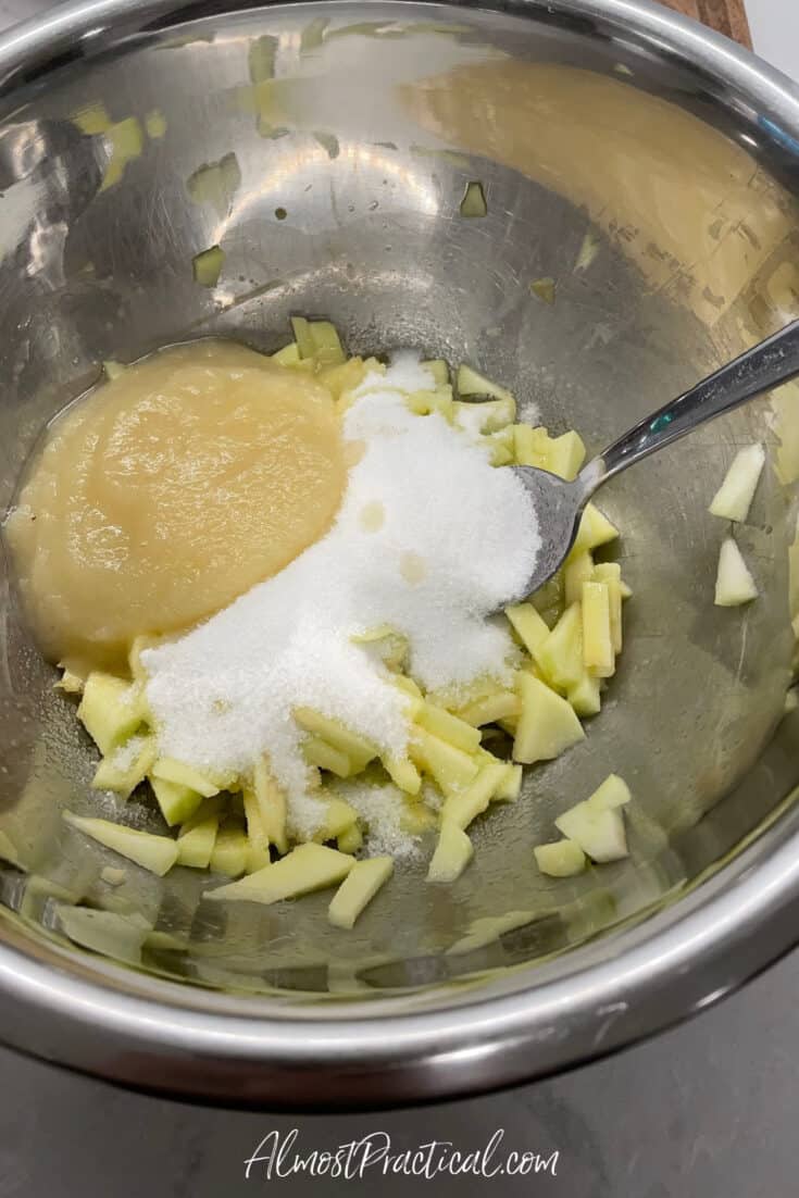 chopped apples, sugar, and applesauce in a mixing bowl