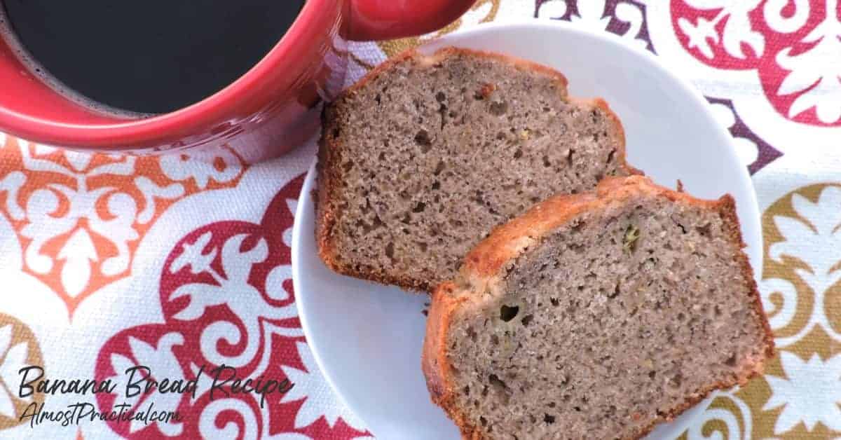 slices of banana bread on plate with a mug of coffee