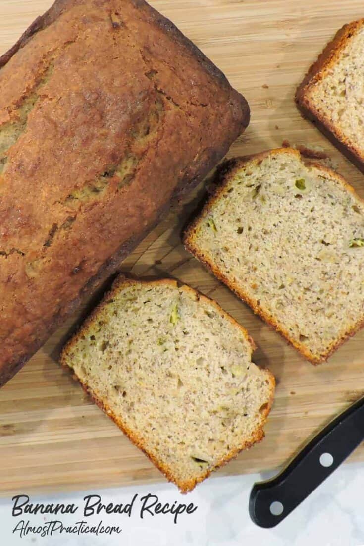 banana bread on cutting board with knife