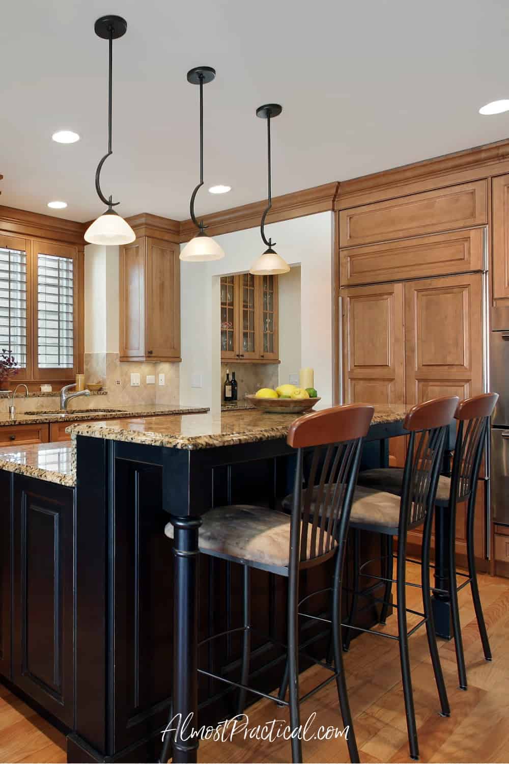 kitchen island with bar height counter tops and 3 bar stools