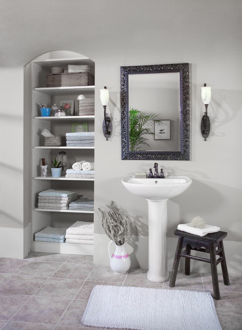 a custom bathroom shelving unit in an alcove