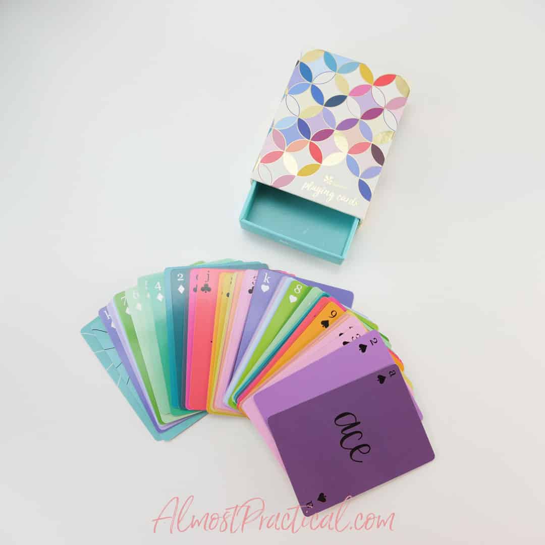 colorful playing cards and box