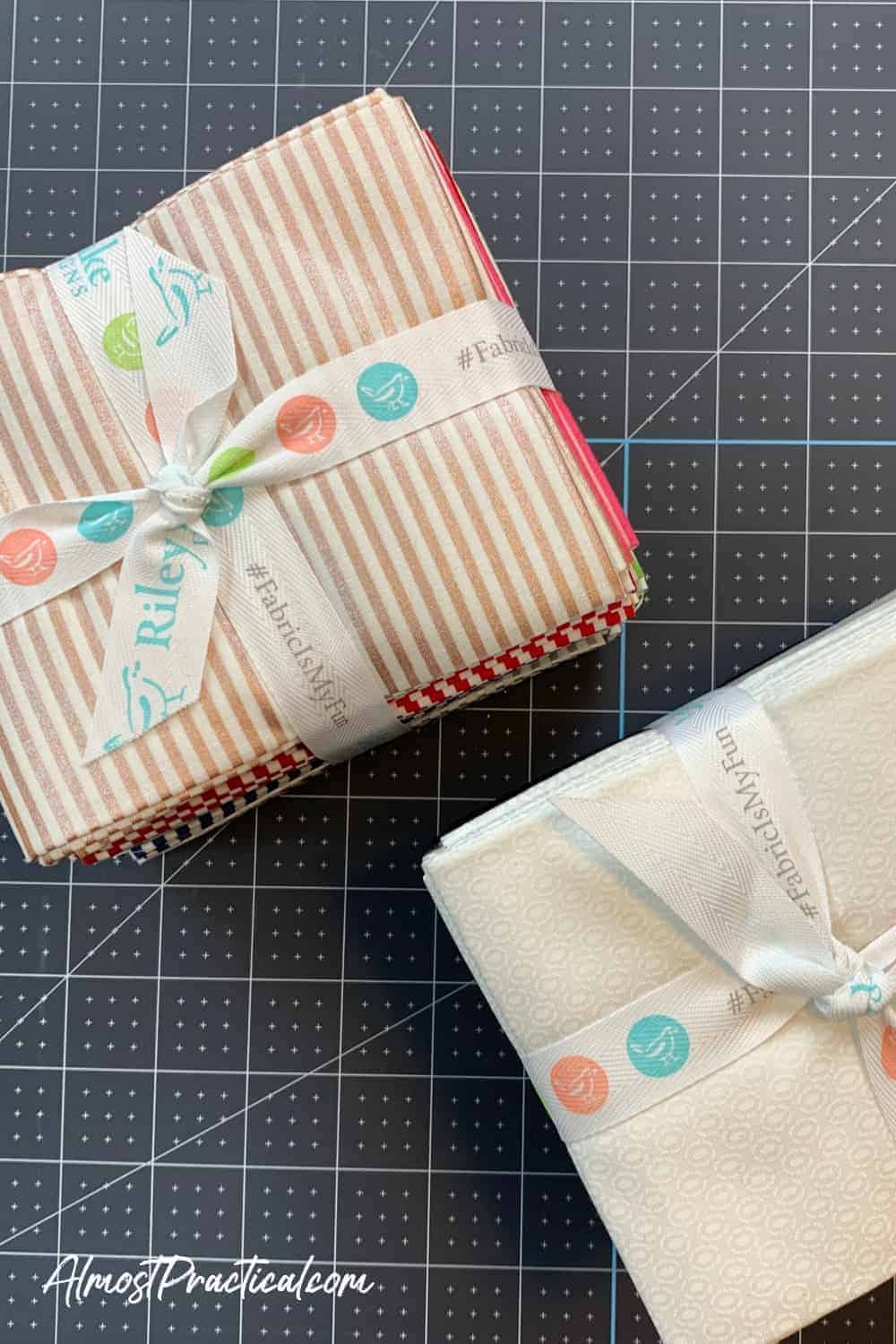 2 fat quarter stacks of fabric in strips and white tied with ribbon from Riley Blake and sold at Cricut