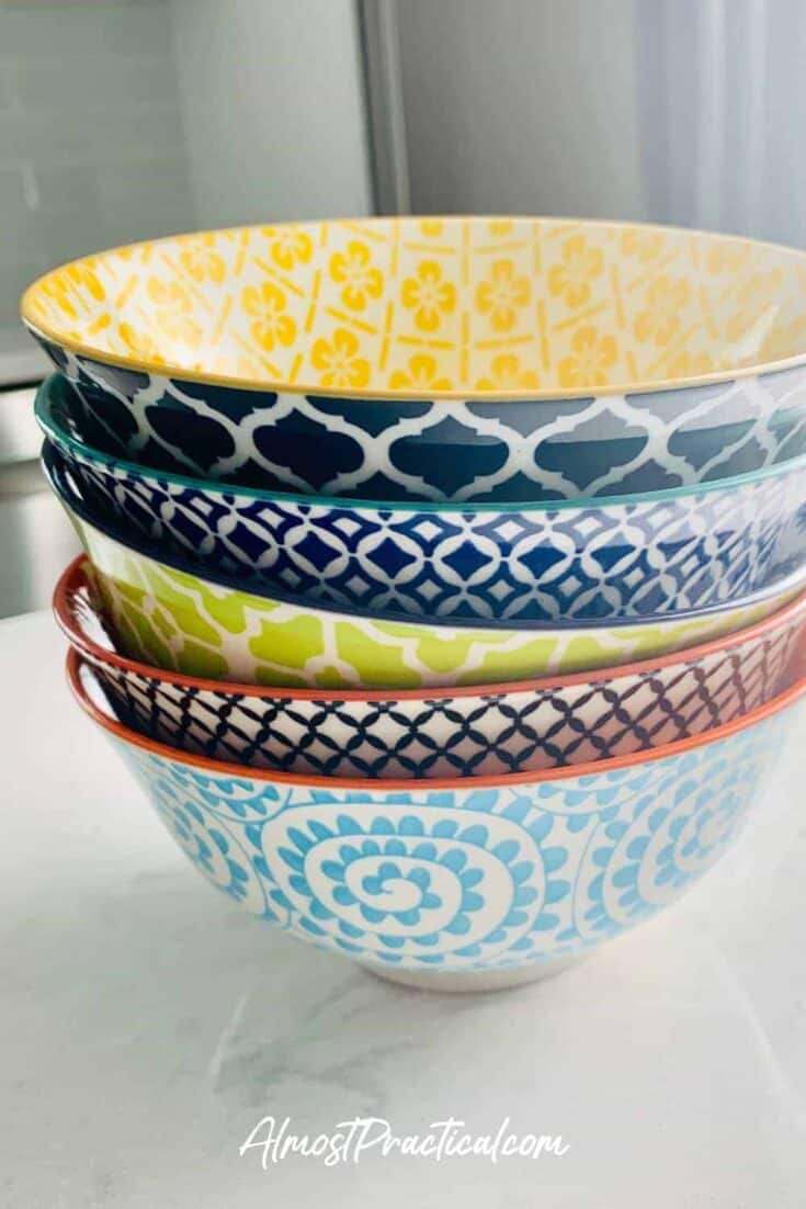 Stack of colorful ceramic bowls.