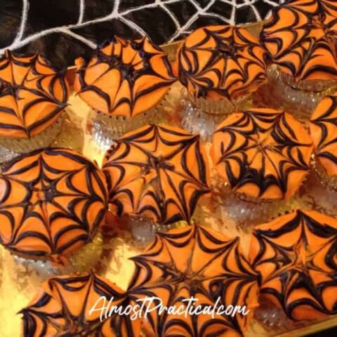 cupcakes with spiderweb pattern in frosting