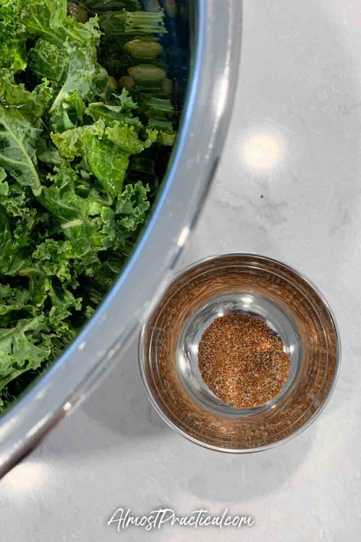 The seasonings for homemade kale chips in a bowl.