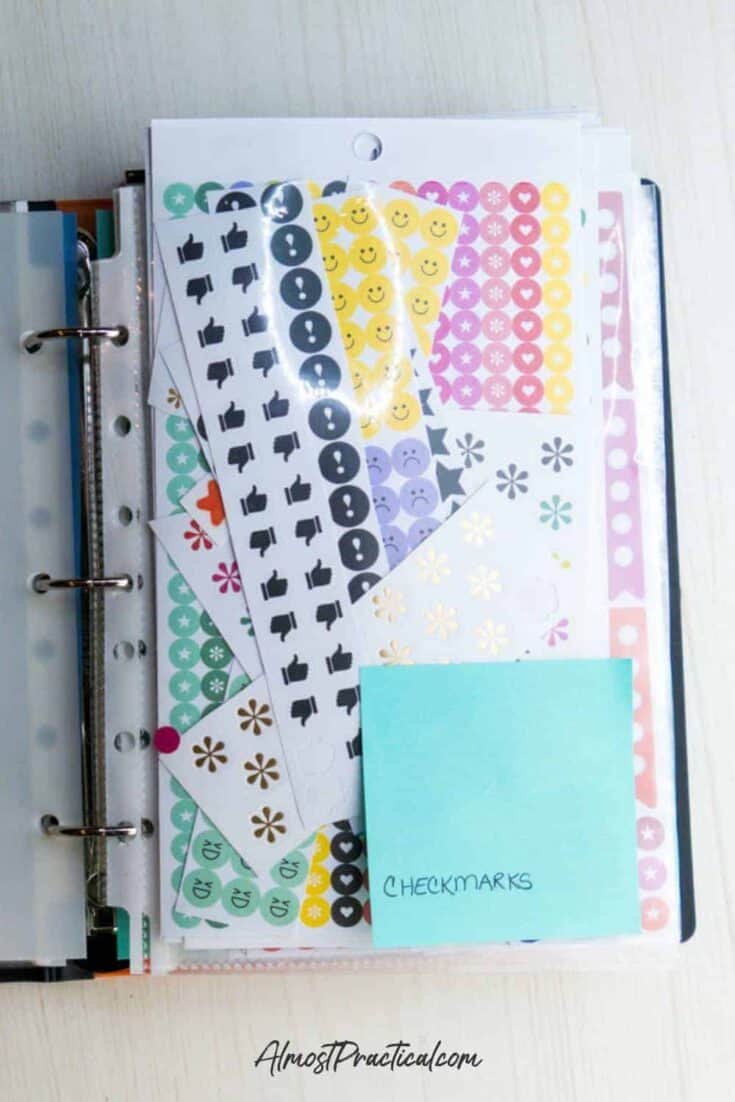 a collection of Happy Planner Stickers in a sheet protector in a binder