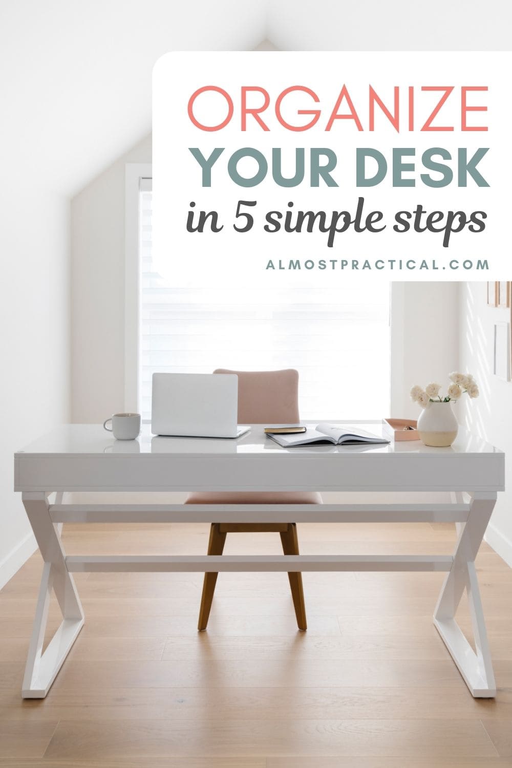 photo of white desk that is neat and tidy with window behind it