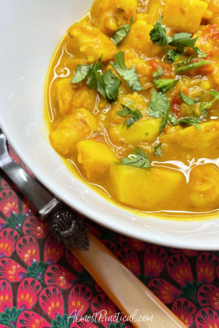 potato sabji in bowl with spoon