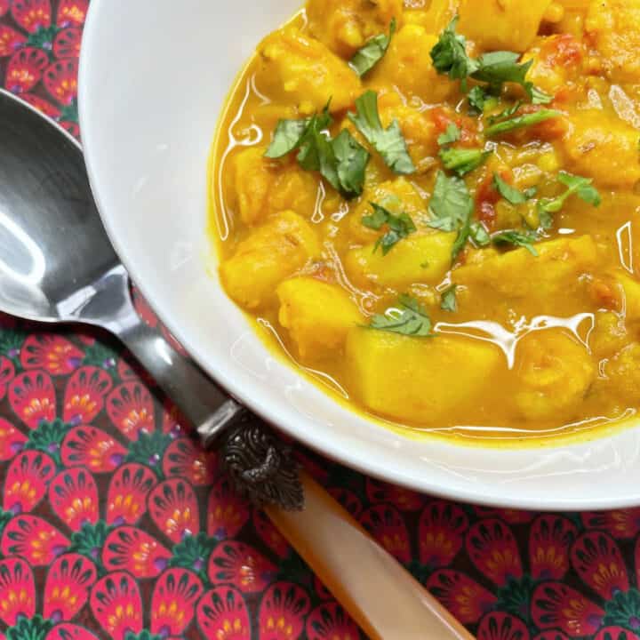 bowl of potato onion and tomato curry