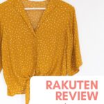 mustard color blouse on a hanger