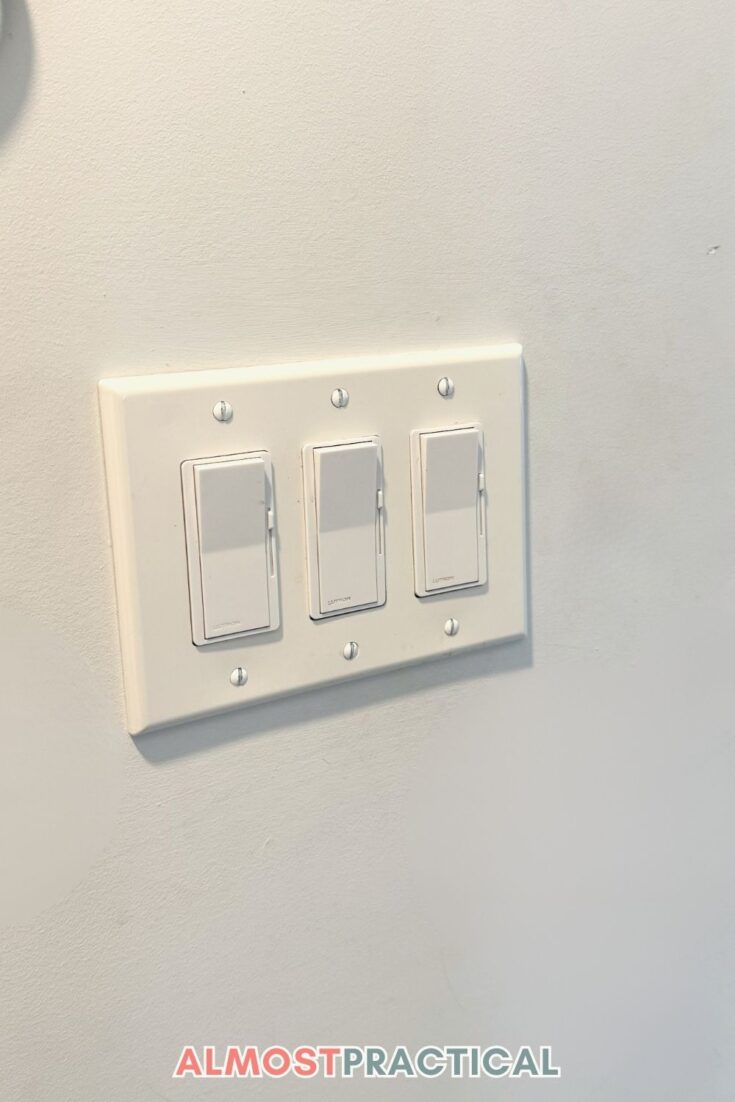 photo of triple rocker light switch with dimmers