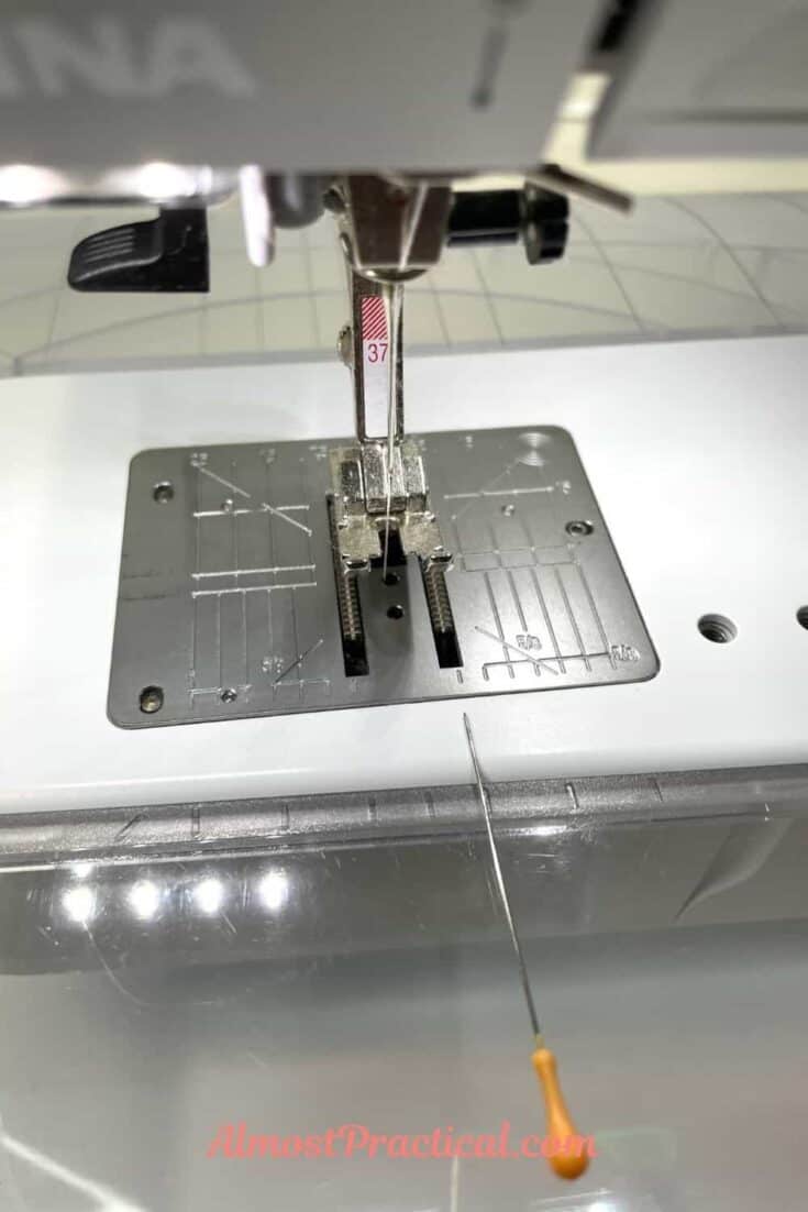 Bernina 475qe sewing machine with number 37 foot and pin pointing to the 1/4 mark on the sole plate