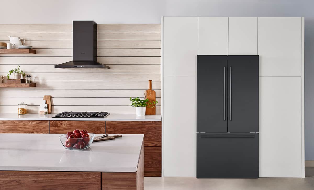 photo of a black stainless steel refrigerator in a modern kitchen